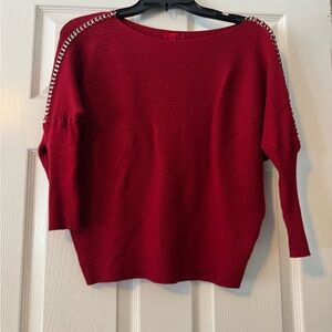 Jennifer Lopez Red Sweater with Embellished Shoulders